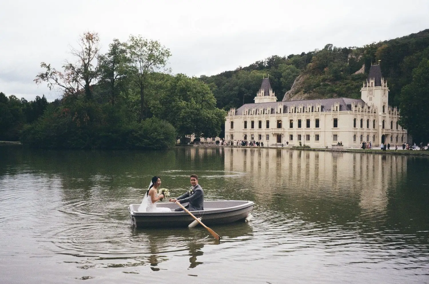 Couple rowing on the lake in front of Schloss Hernstein, on 35mm film