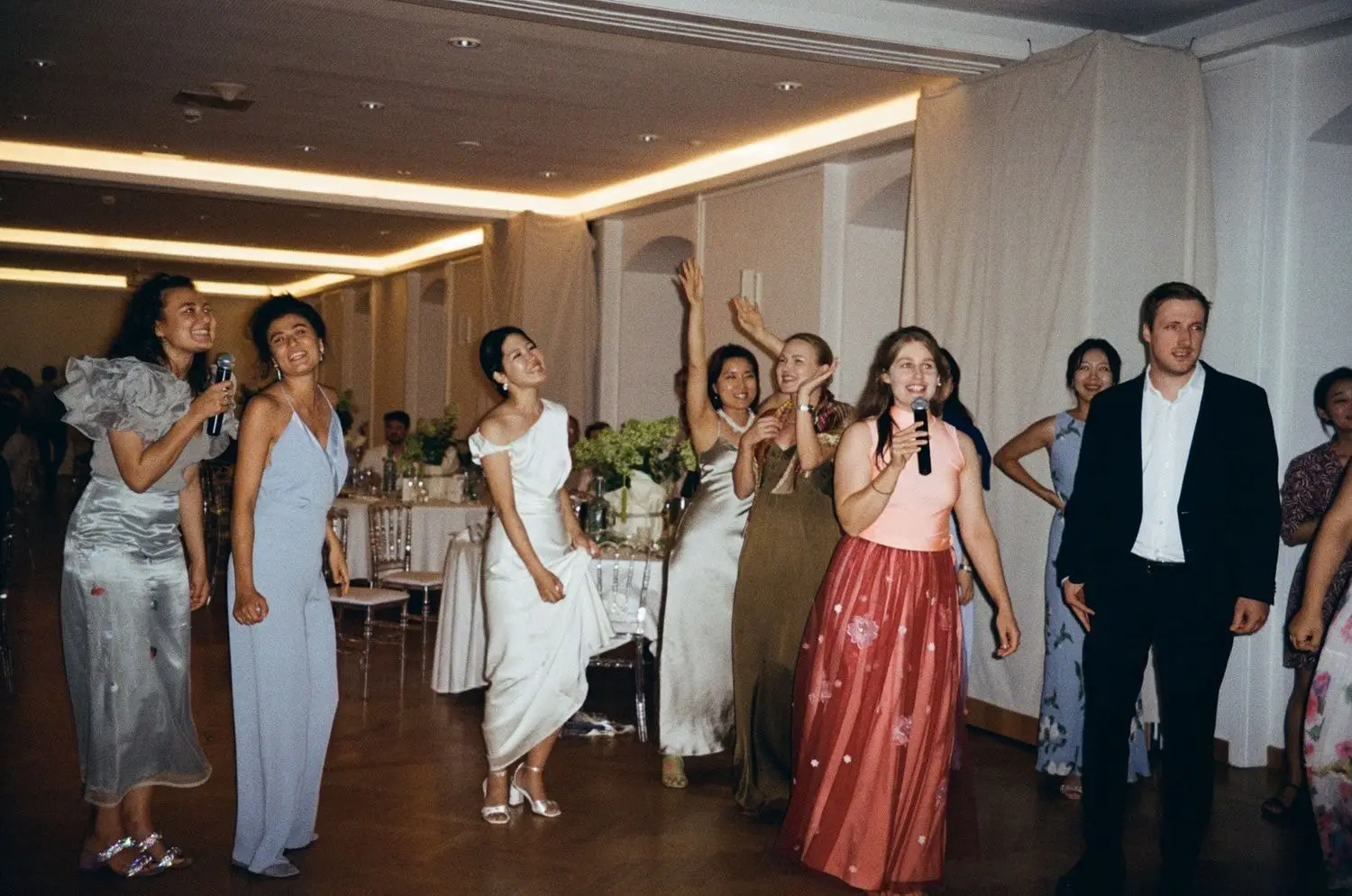 Bride dancing with guests at the reception, on 35mm film