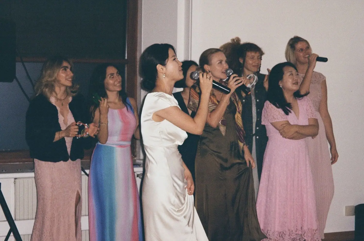 Bride singing karaoke with friends, on 35mm film