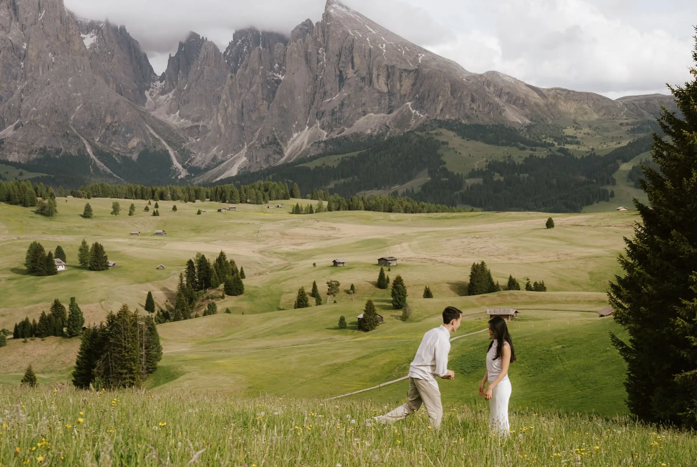 Wide view of the proposal on the Alpe di Siusi with the Dolomites towering behind