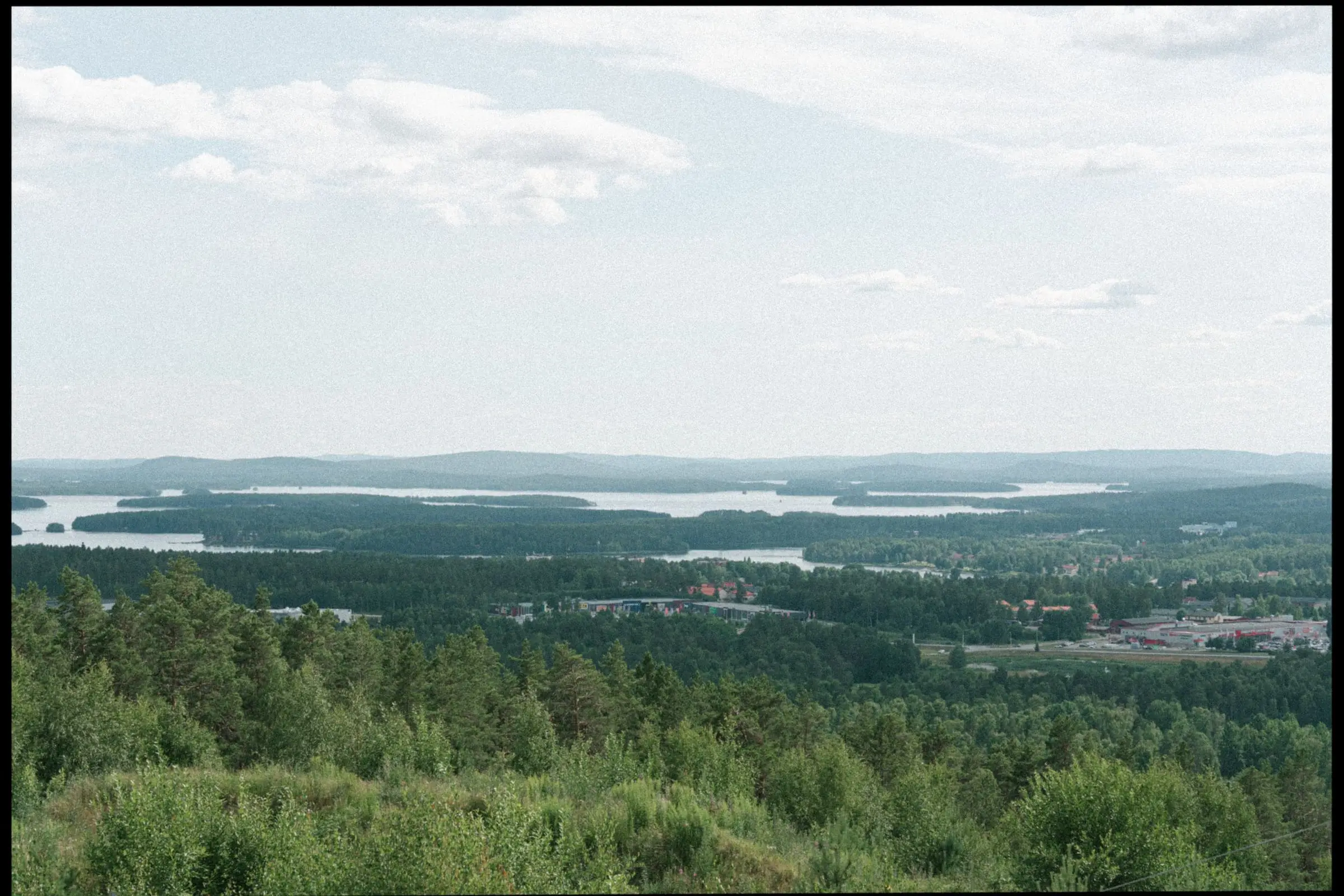 View over the forests and lakes of Dalarna near Falun, on film
