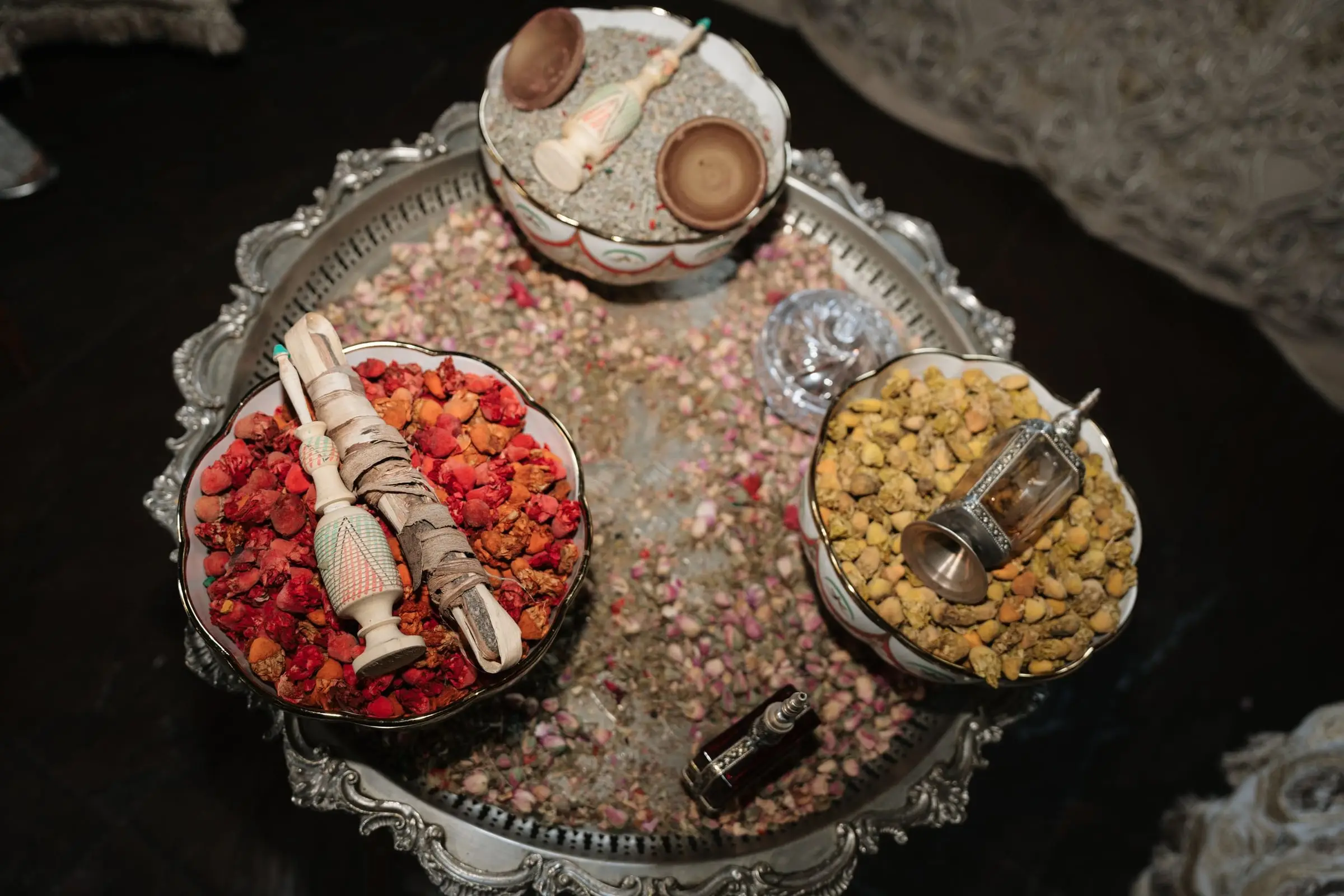Silver tray with dates, rose petals and incense for the Moroccan ceremony