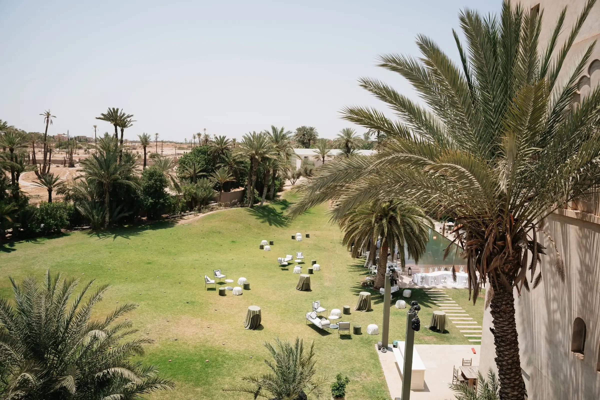 View over the lawn and palm grove of Ksar Char Bagh