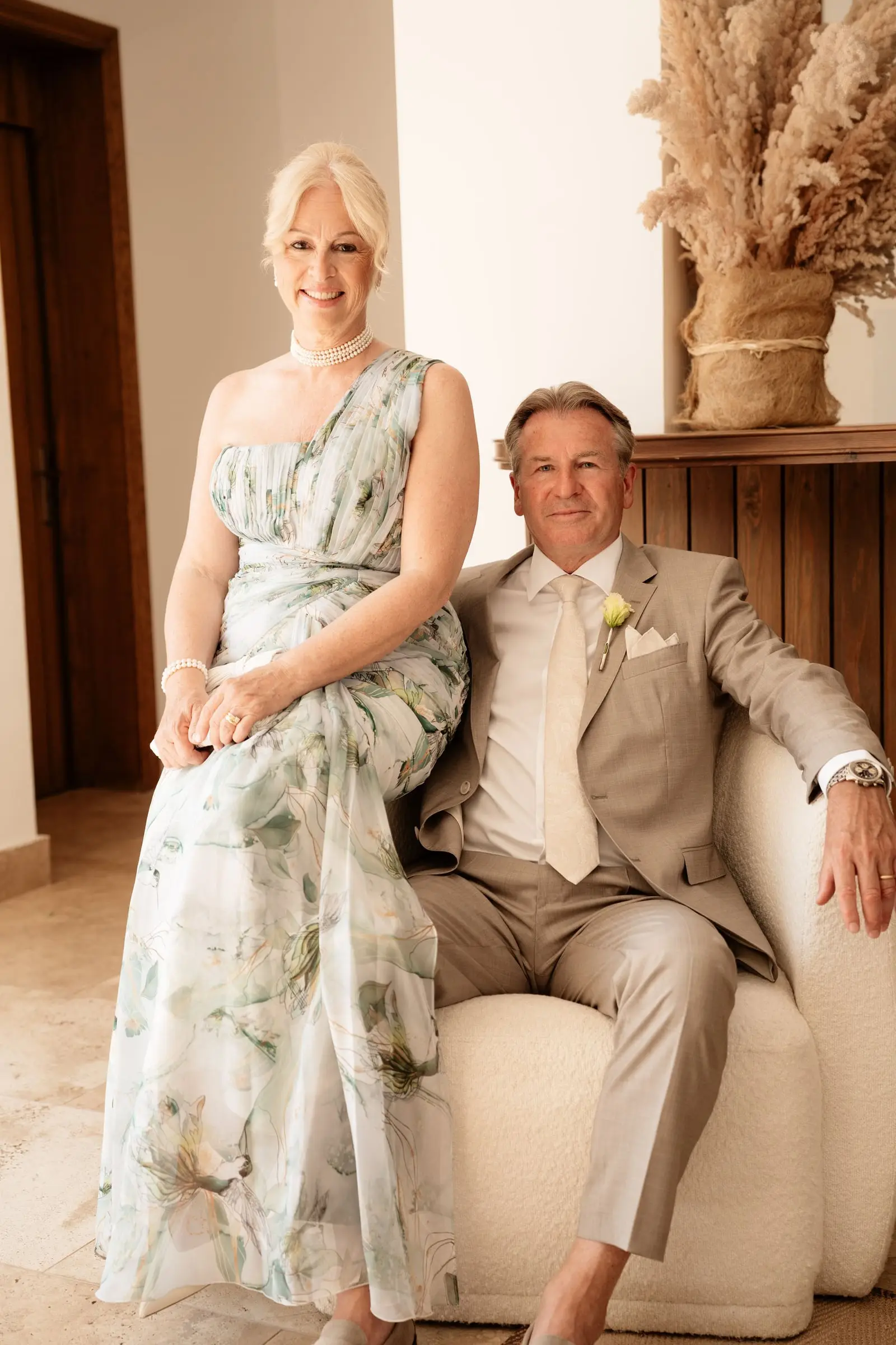 Parents of the couple sitting together in an elegant lounge