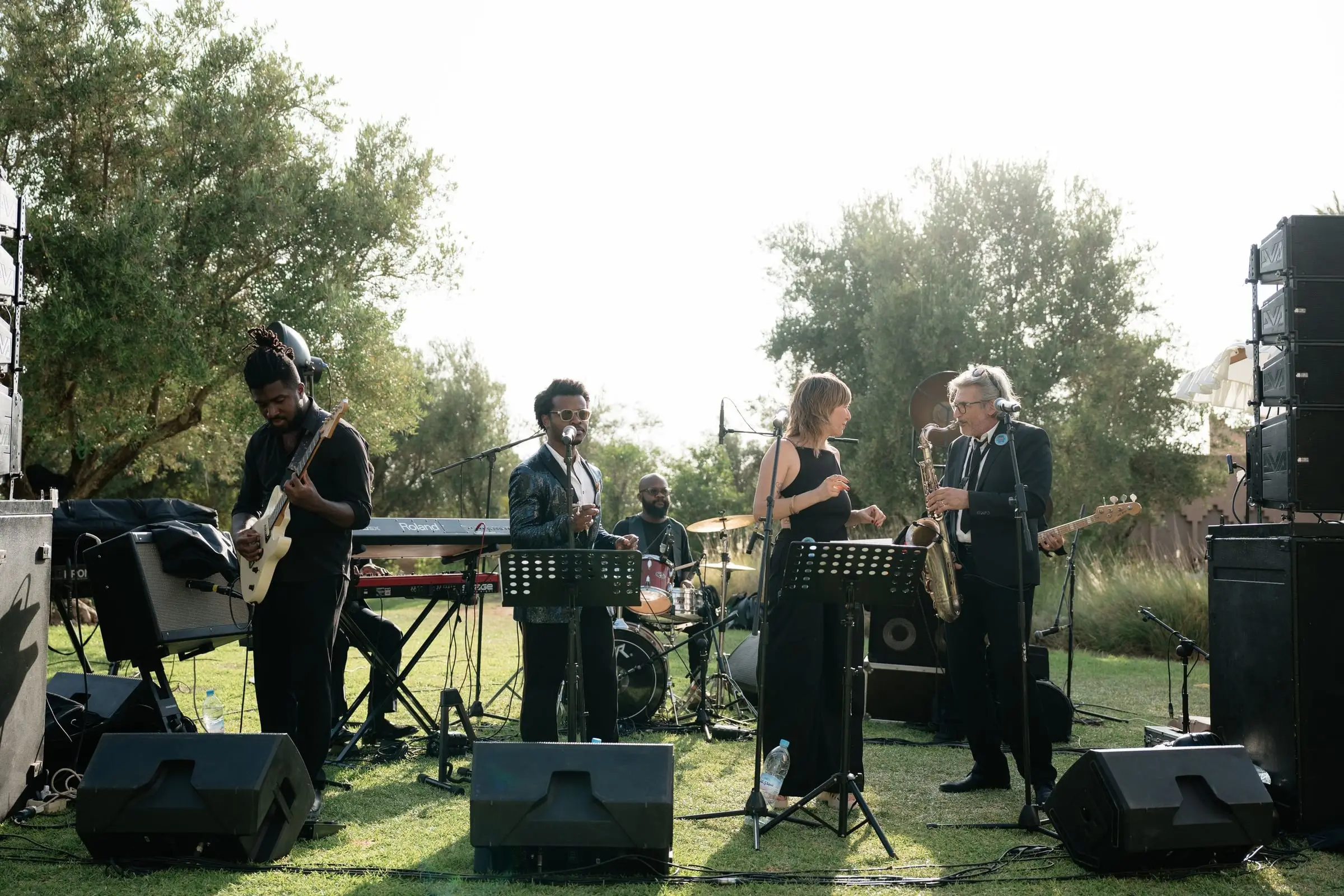 Live band with saxophone playing on the lawn in the afternoon