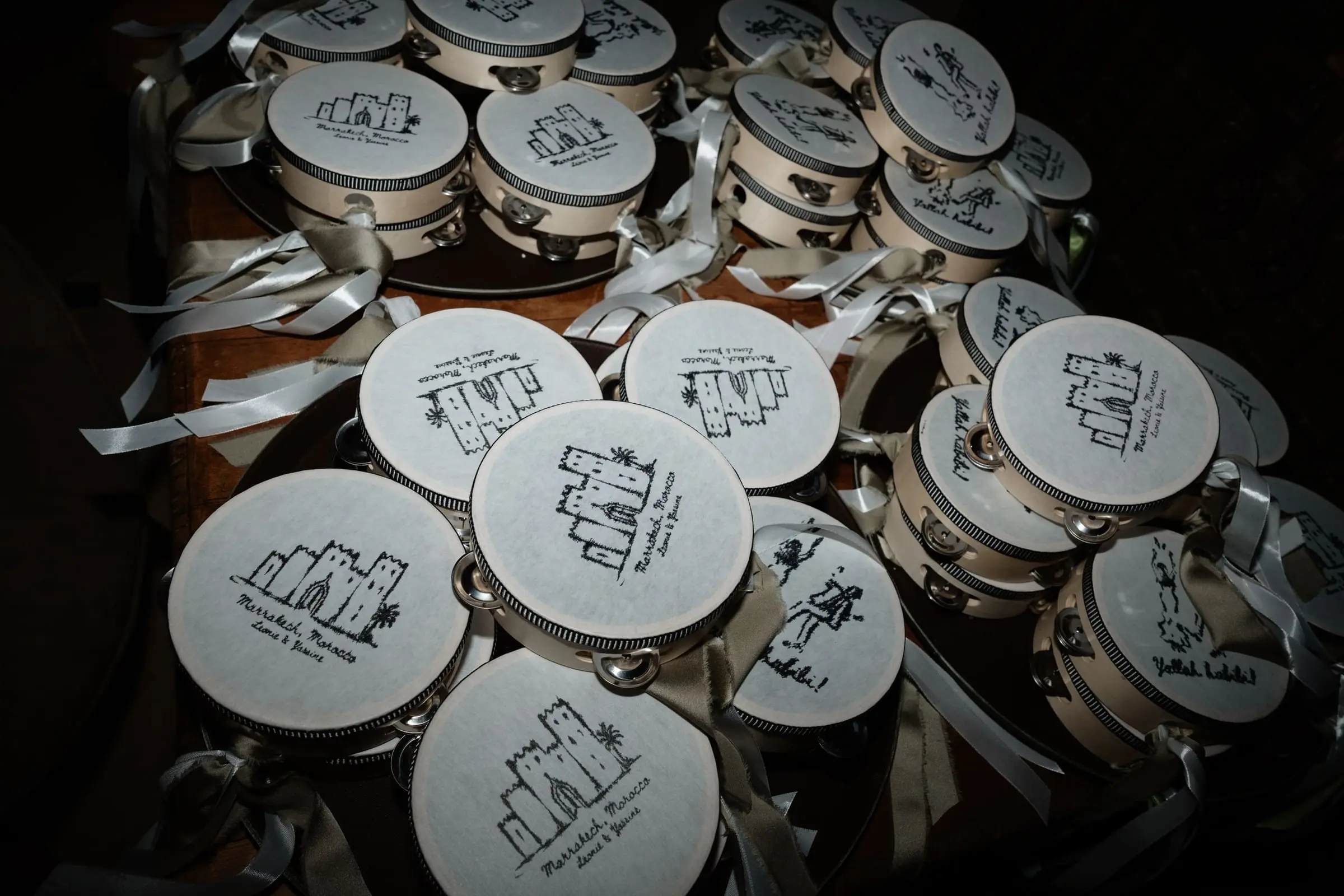 Illustrated wedding favours stacked on a table