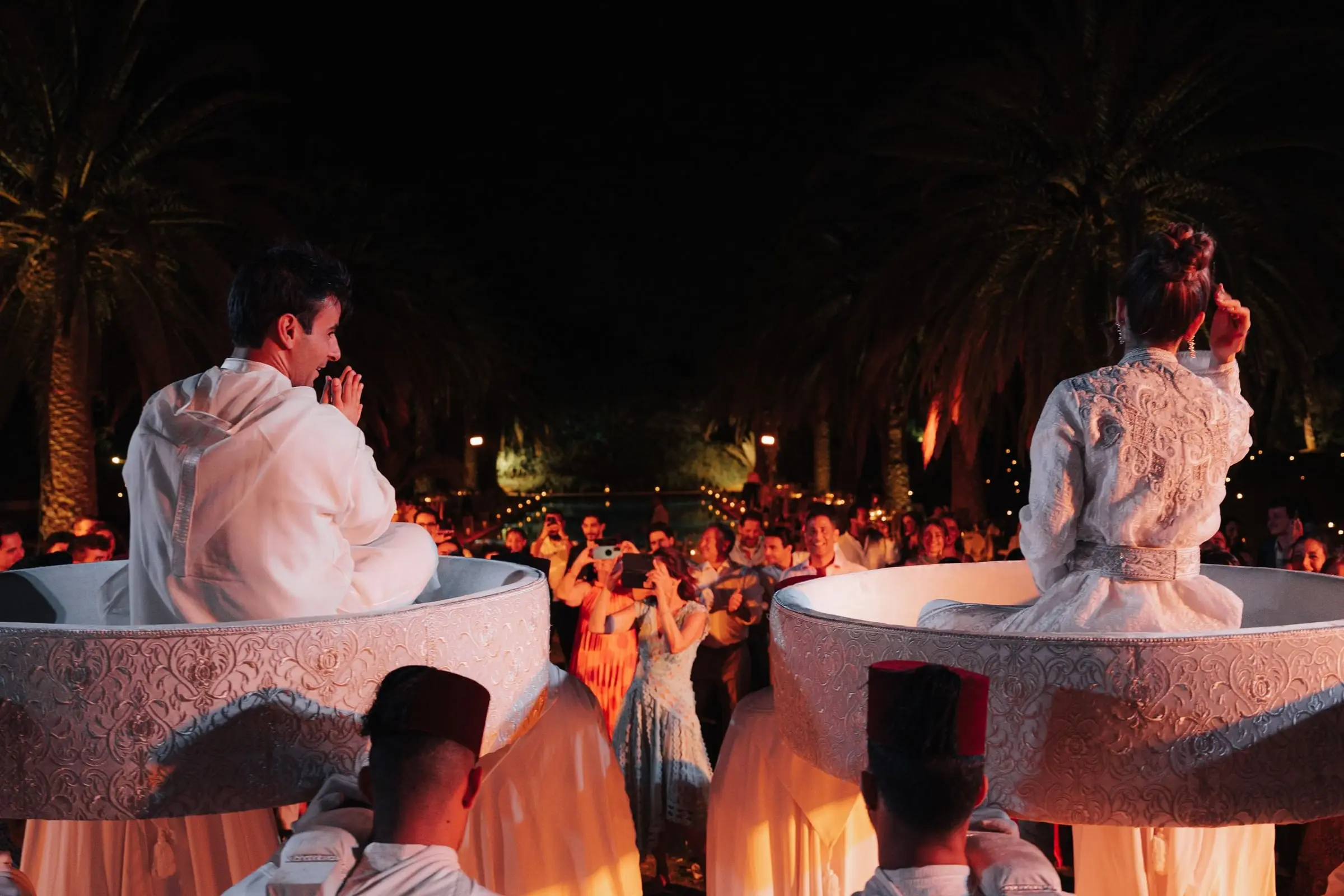 Bride and groom carried on the Amaria above the dancing guests