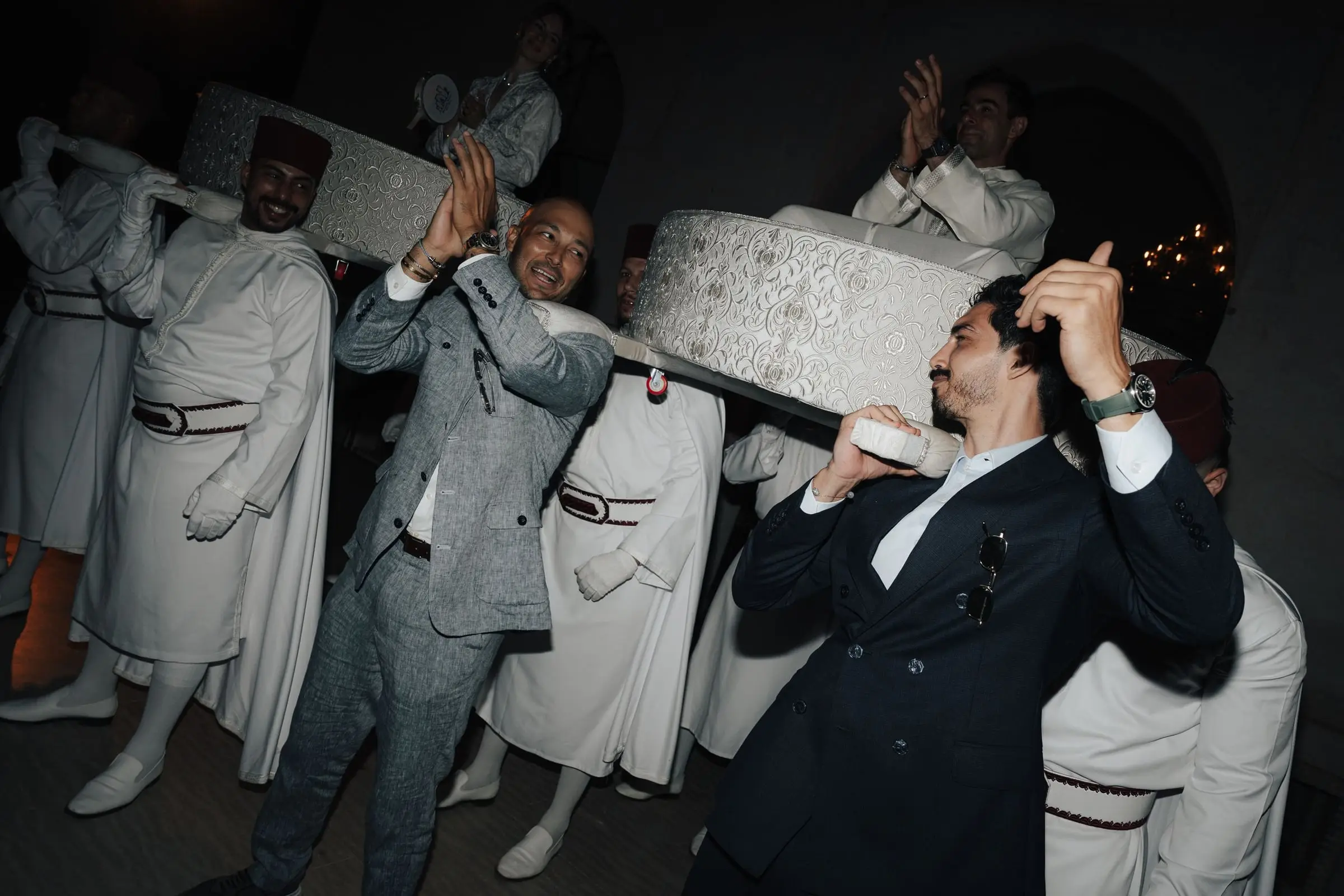 Guests cheering as the Amaria carries the couple in