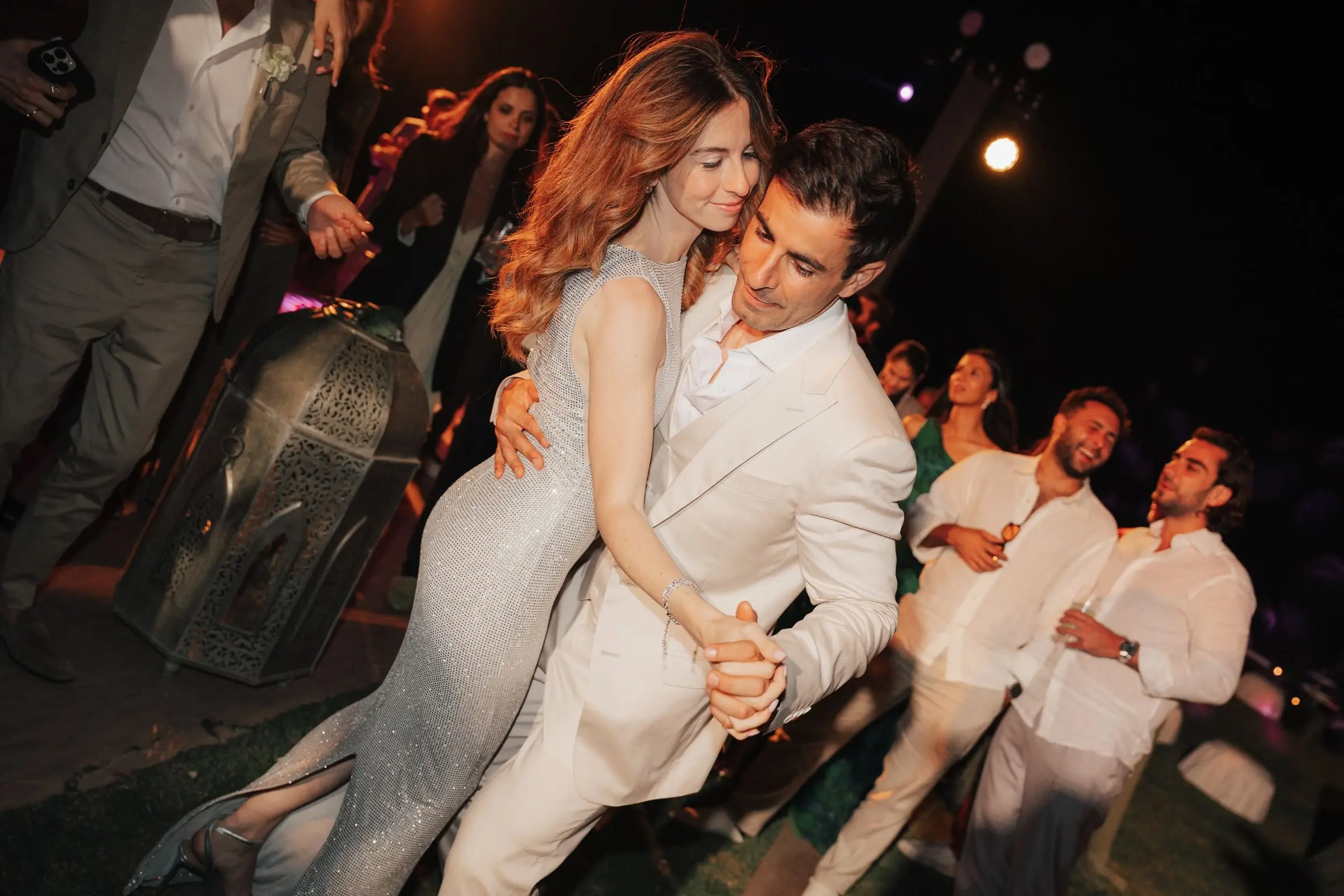 Groom dipping the bride on the dance floor