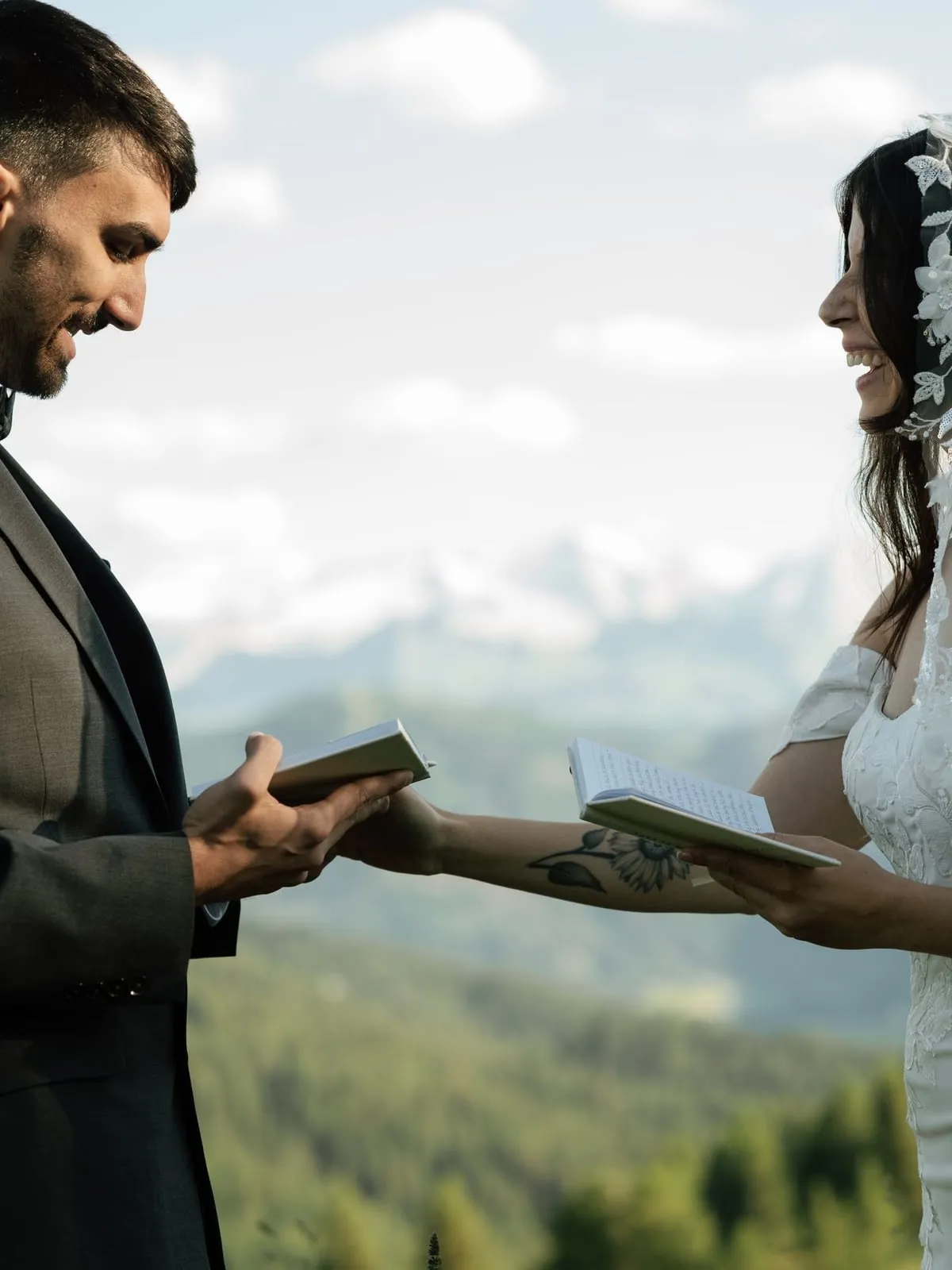 Bride and groom reading their vows to each other in the mountains of La Val