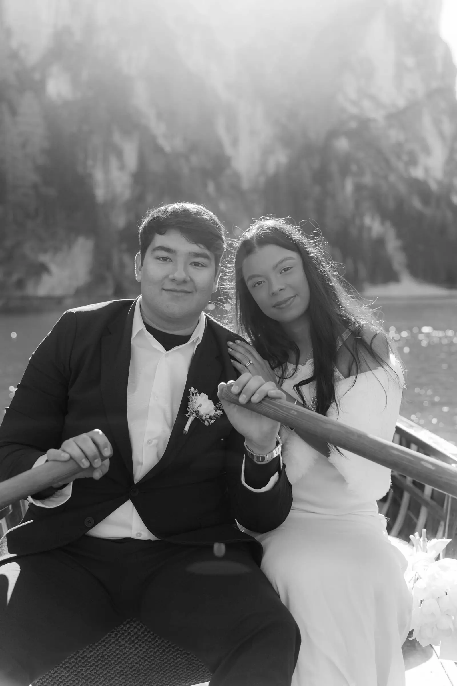 Black and white photo of the smiling couple in the boat