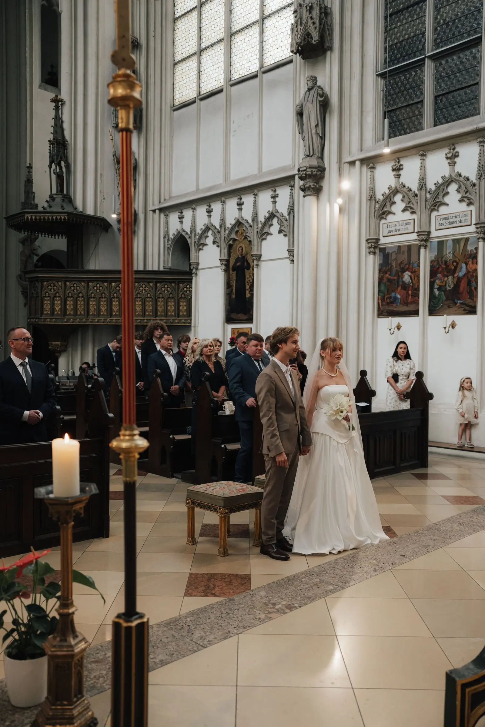 Bride and groom walking down the aisle of the Gothic church Maria am Gestade