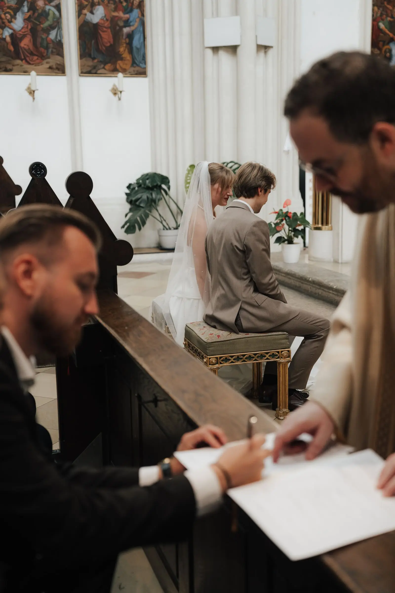 Witnesses signing the marriage register in the church