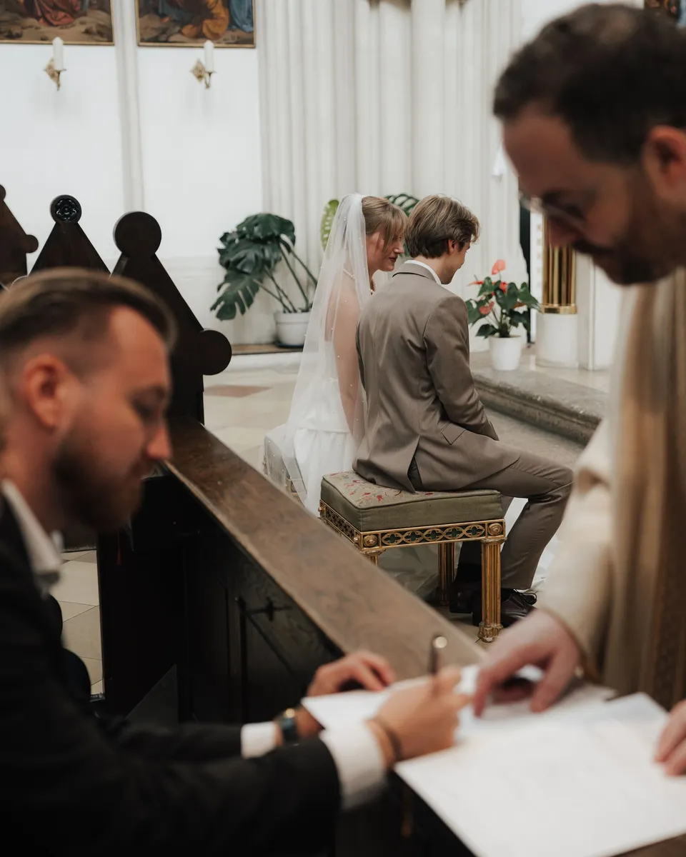 Witnesses signing the marriage register in the church