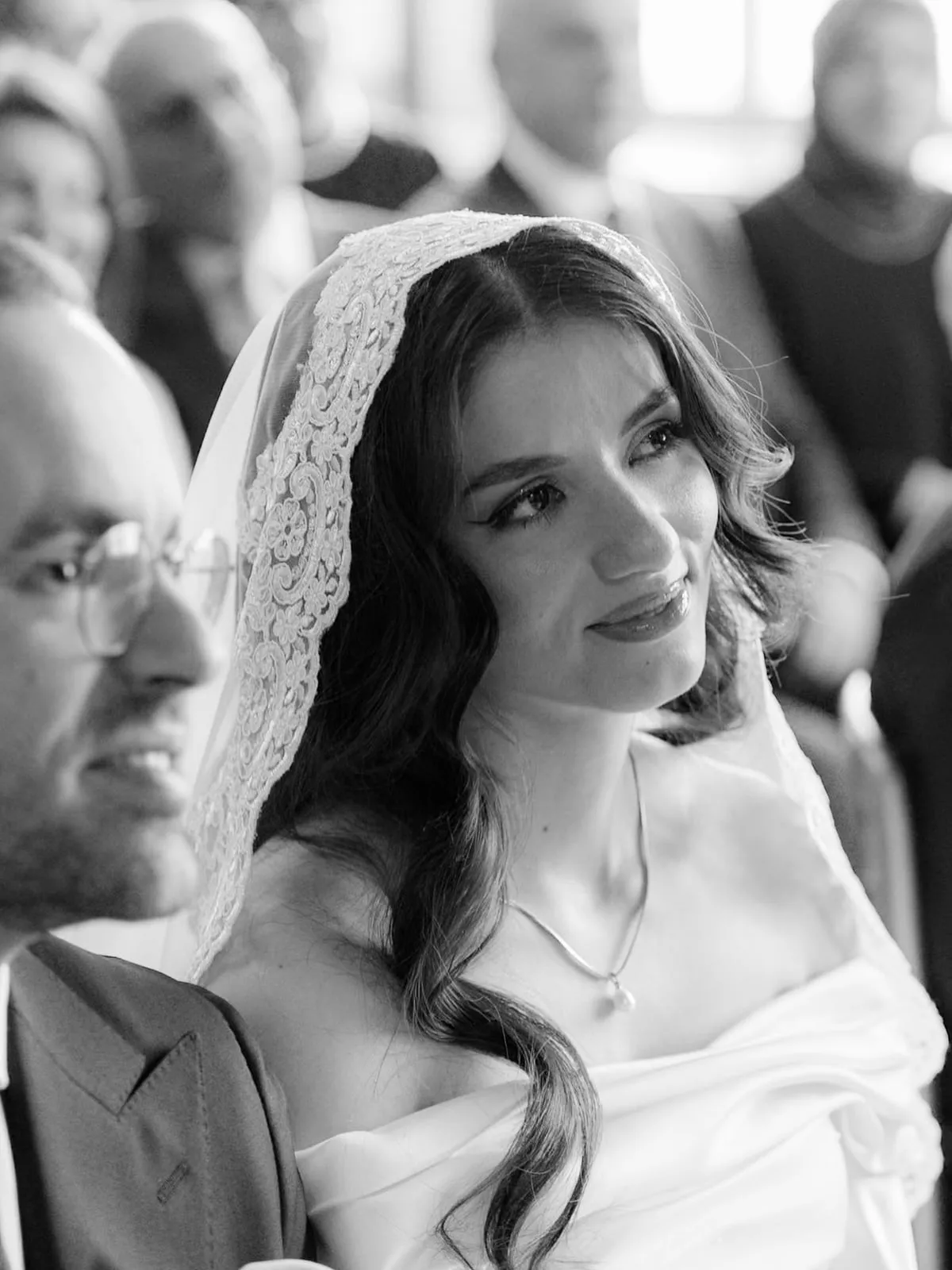 Black and white photo of the bride smiling during the civil ceremony