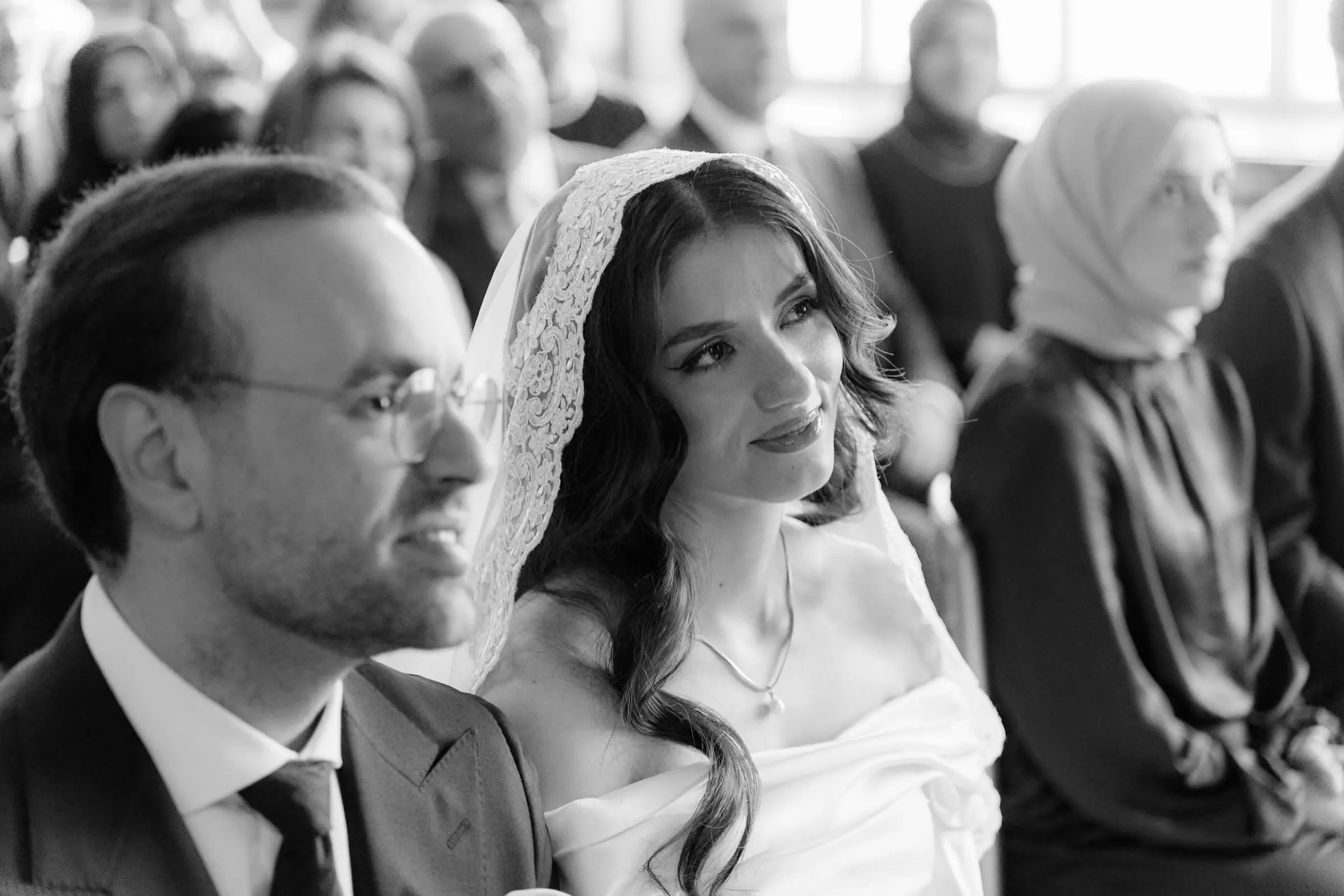 Black and white photo of the bride smiling during the civil ceremony