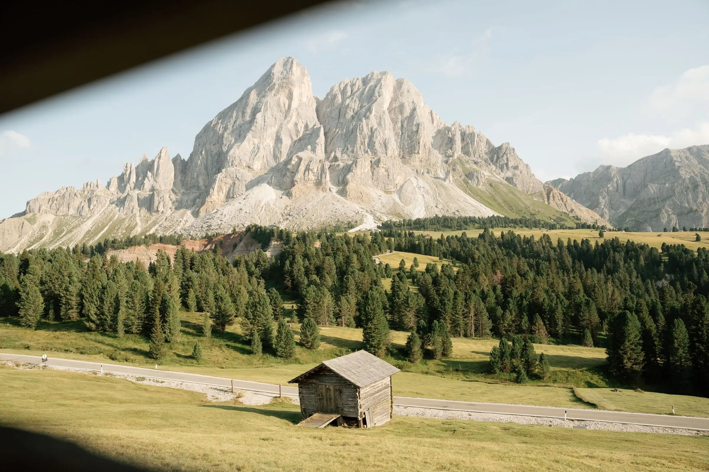 A wooden hut in the meadow below the Sass de Putia at Passo delle Erbe