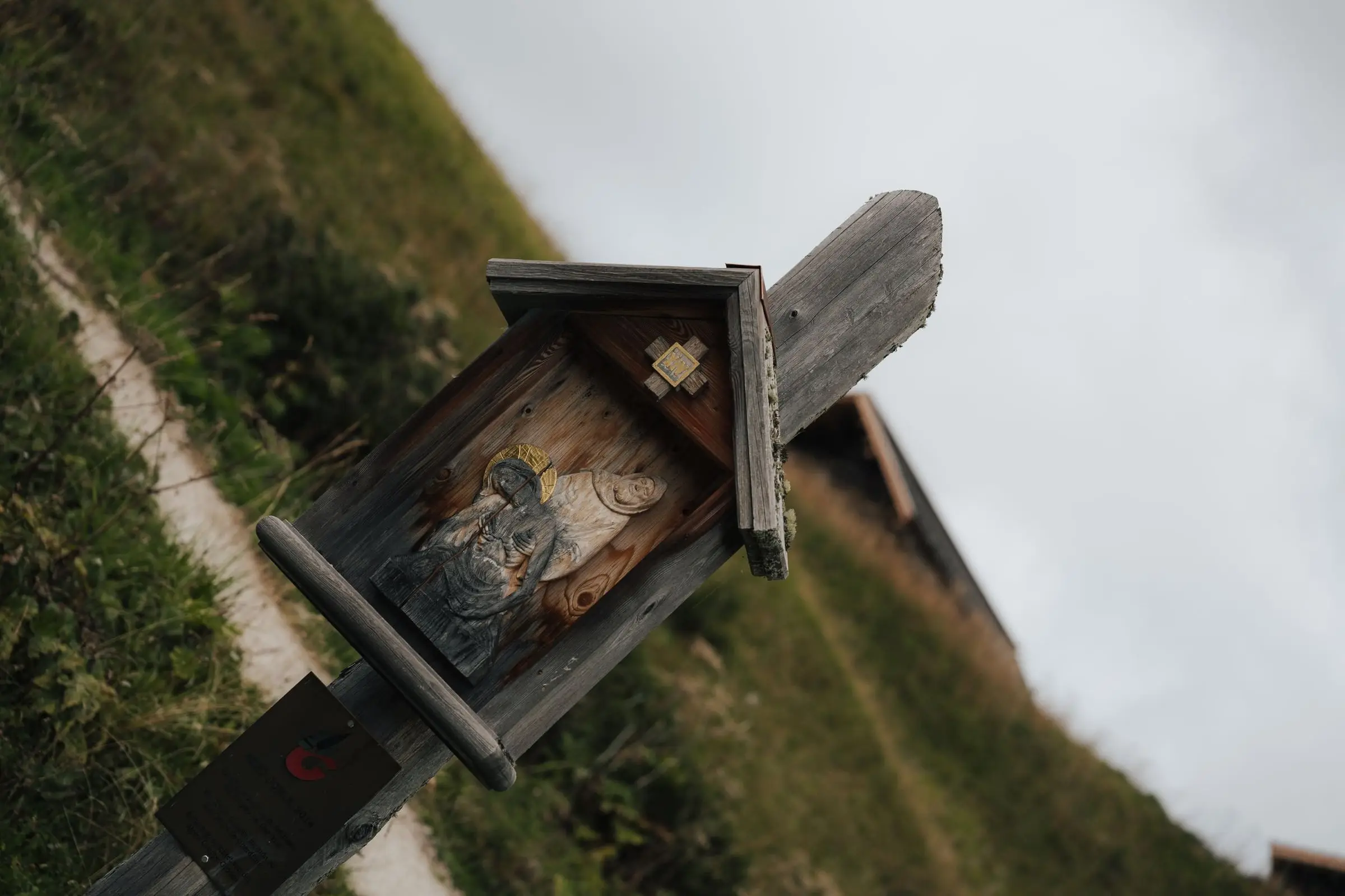 Wooden wayside shrine by the hiking path
