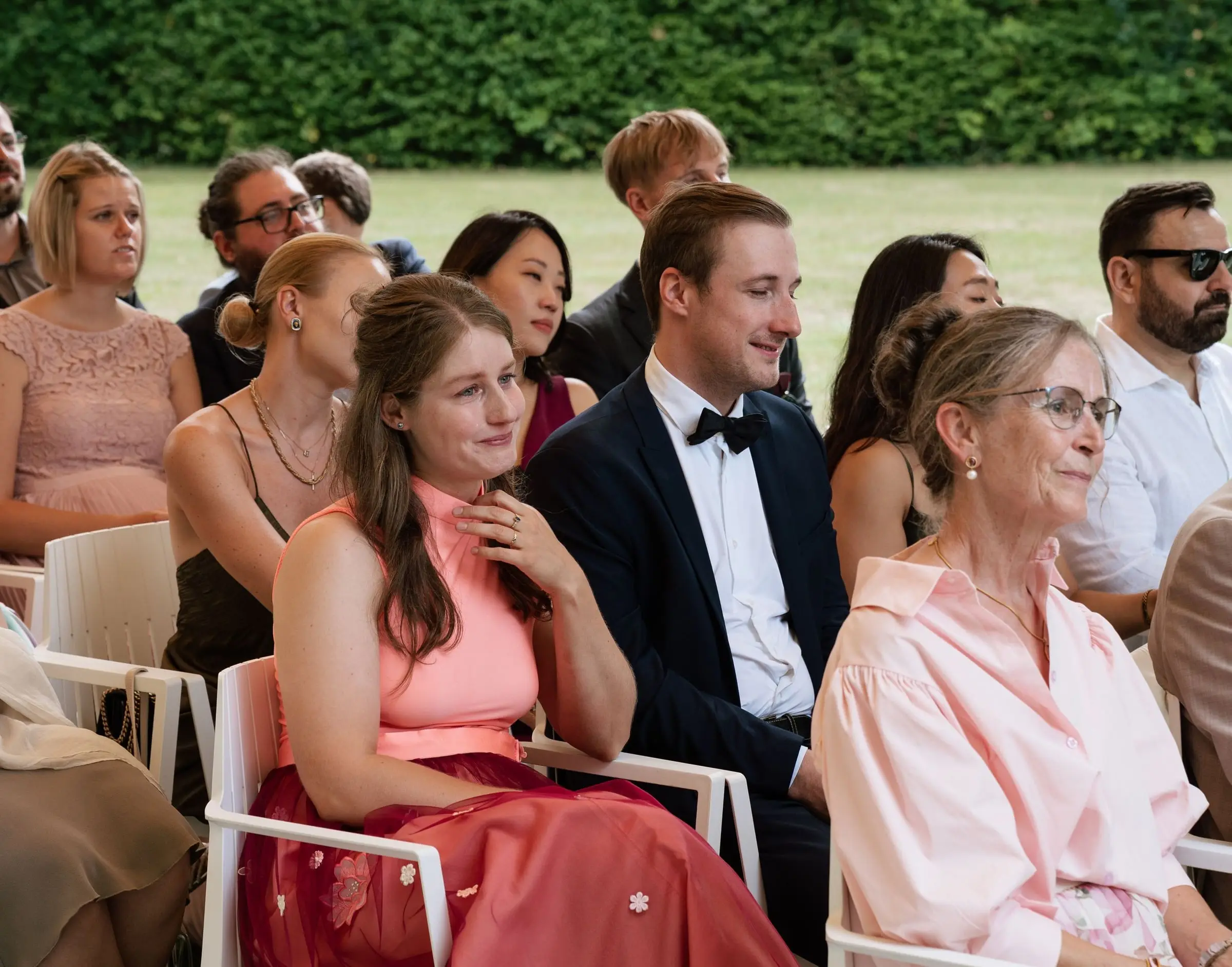 Guests smiling during the outdoor ceremony