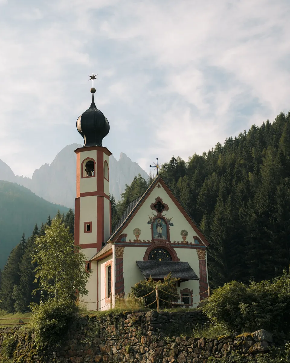 St. John's Chapel in Ranui with its onion dome below the Odle peaks